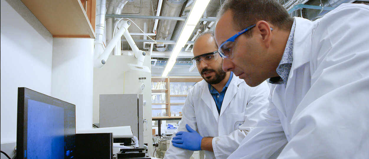 Professor Stephane Angers &amp; Post doc fellow Rony Chidiac working in lab