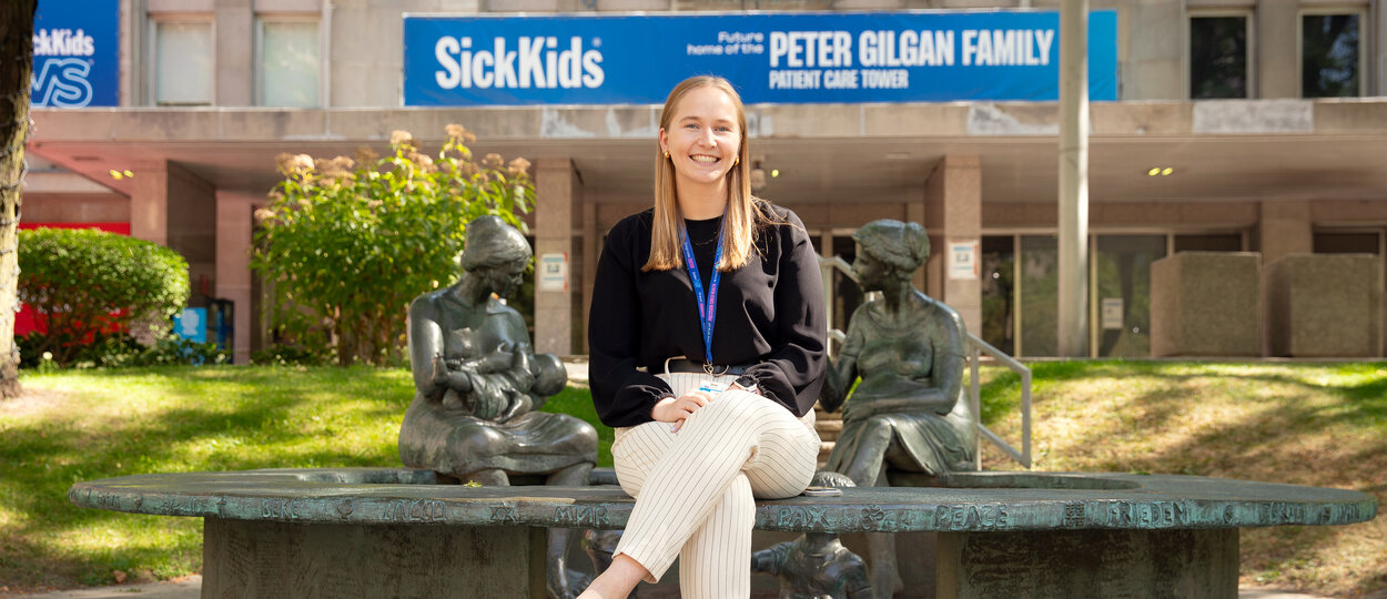 MScPhm trainee Maddy Hannah pictured out front of the Hospital for Sick Children (SickKids)