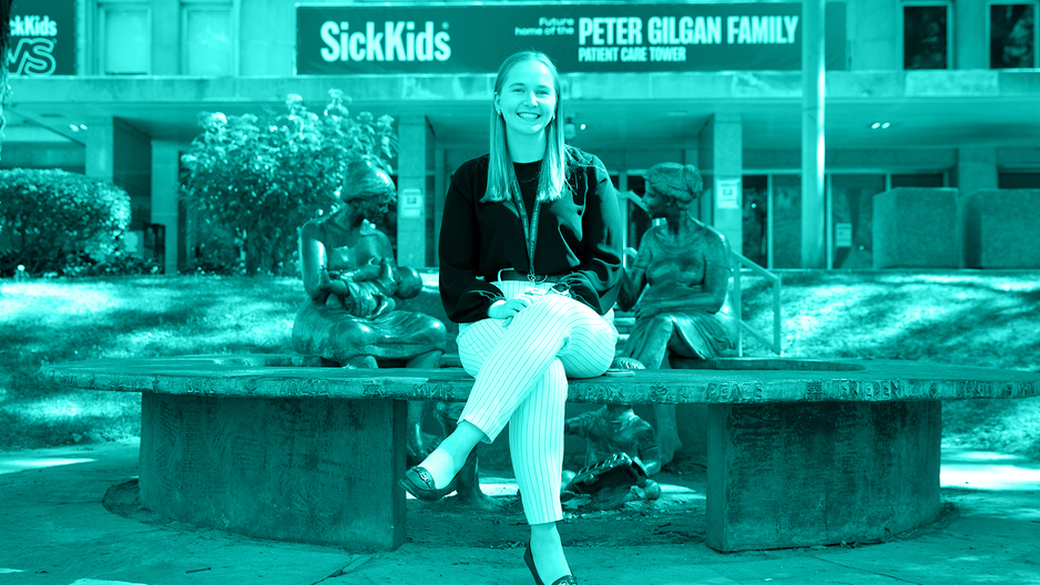 MScPhm trainee Maddy Hannah sitting outfront SickKinds hospital