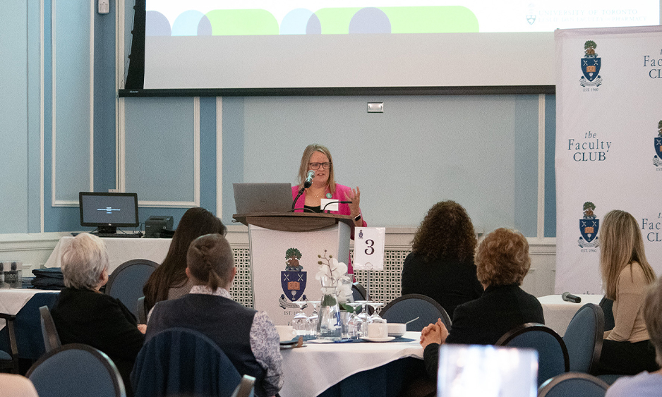 Natalie Crown, associate professor, at podium