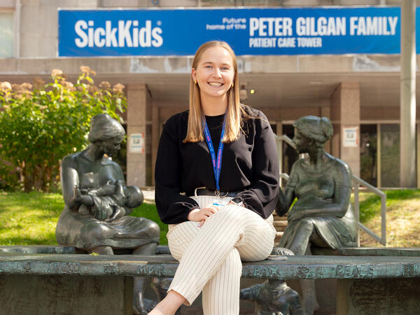MScPhm trainee Maddy Hannah pictured out front of the Hospital for Sick Children (SickKids)