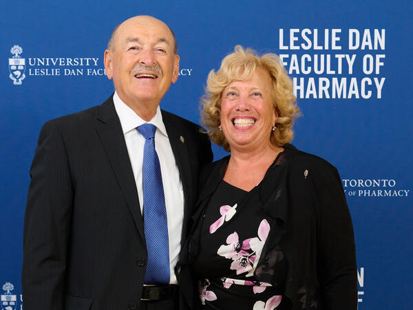 Frank and Doris Kalamut pictured infront of Leslie Dan Faculty of Pharmacy photo backdrop