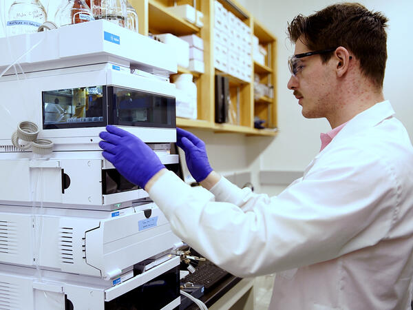 Li lab member working with lab equipment