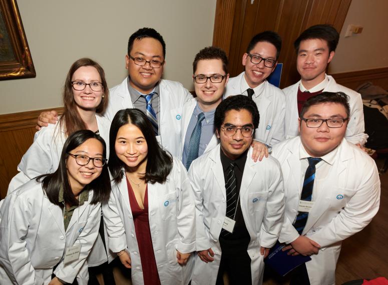 2T3 Whitecoat group shot Students posing for photograph in white coats